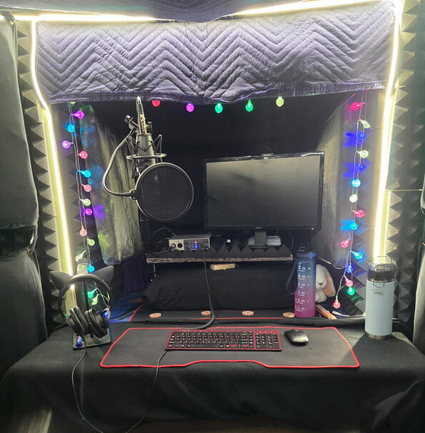 Cozy Studio Recording studio front wall with microphone, interface, monitor, keyboard & mouse, and sound treatment